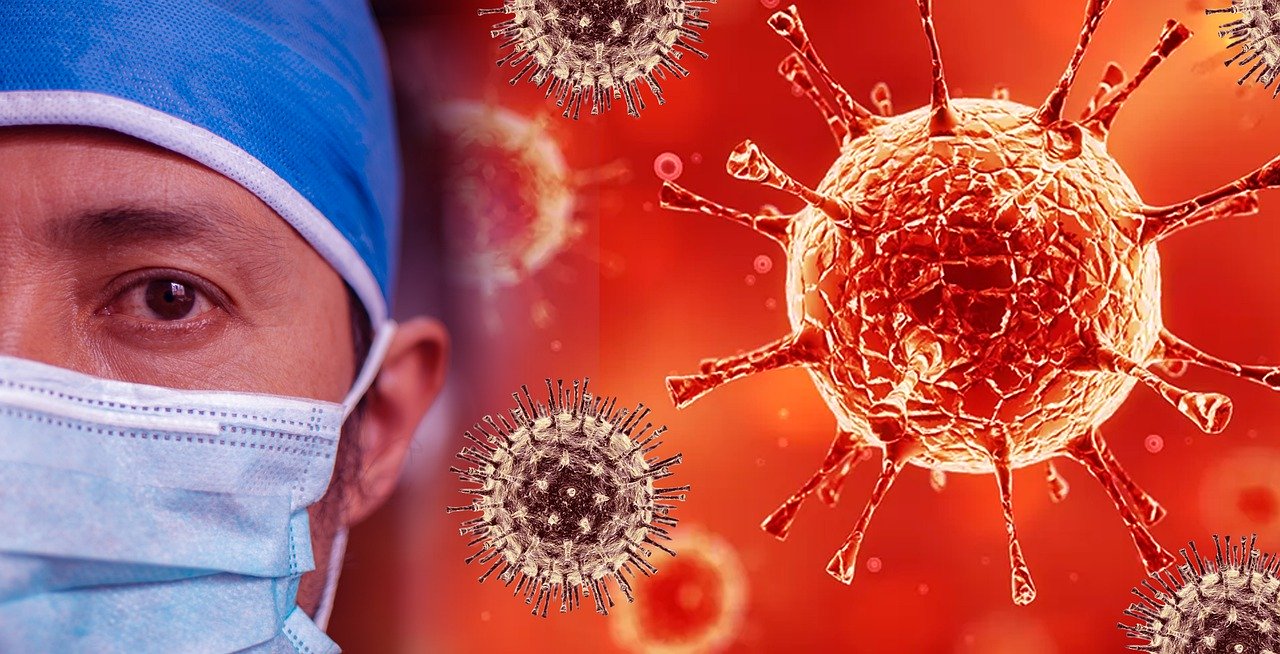 man in mask with virus image behind